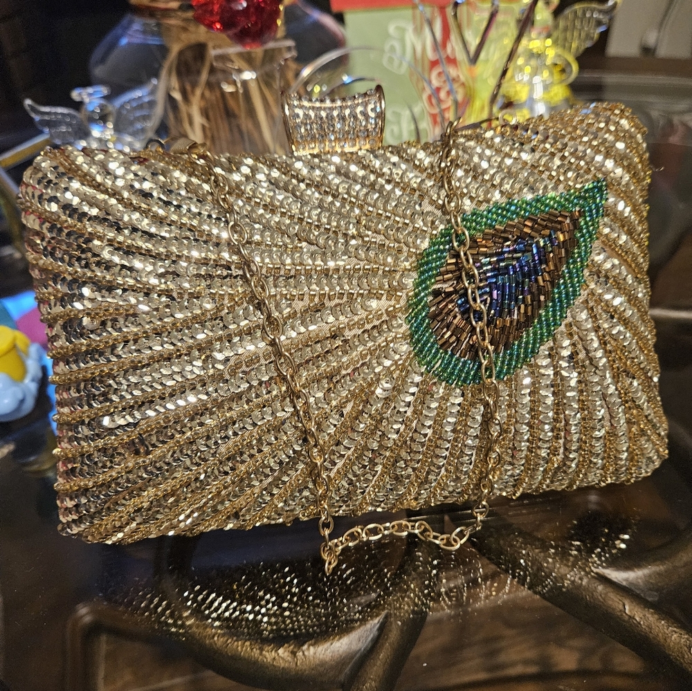 Elegant Gold Clutch with Peacock Design